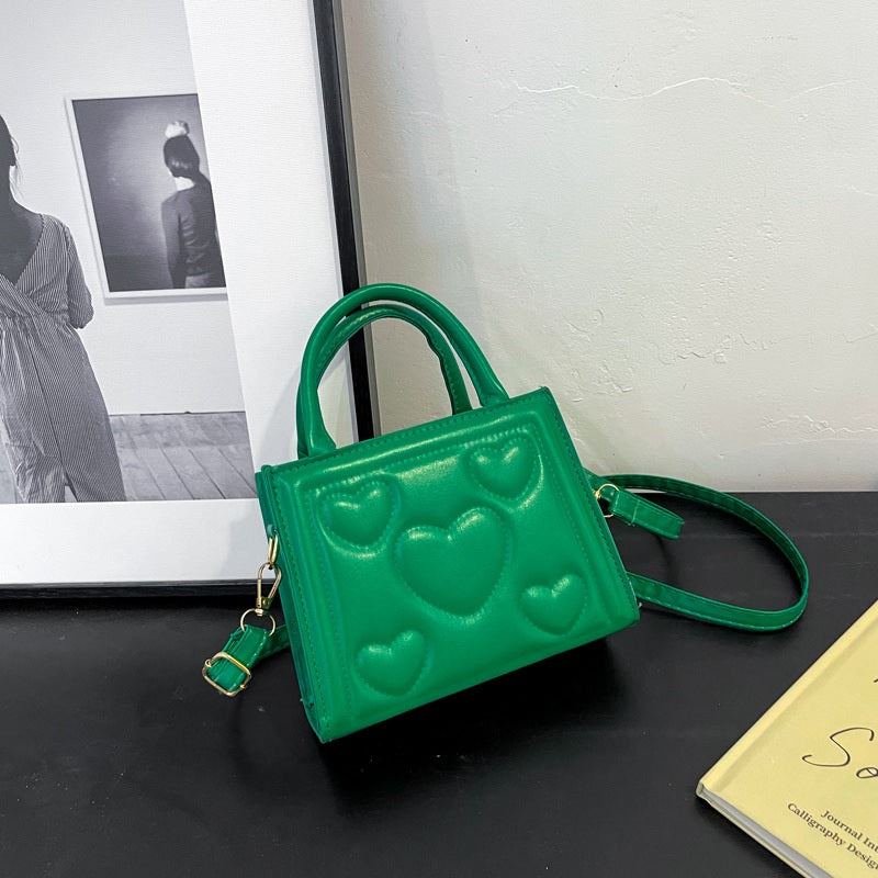 1pc Women’s Stylish Solid Color Handbag with Detachable Strap – Heart Pattern Design, Perfect for Valentine’s Day Gift, Available in Magenta, White, Black, Green, Yellow